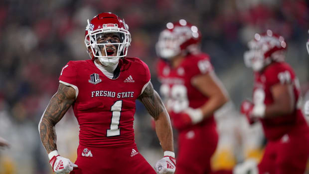 Nov 25, 2022; Fresno, California, USA; Fresno State Bulldogs wide receiver Nikko Remigio (1) reacts after catching a pass for a touchdown against the Wyoming Cowboys in the first quarter at Valley Children's Stadium. Mandatory Credit: Cary Edmondson-USA TODAY Sports